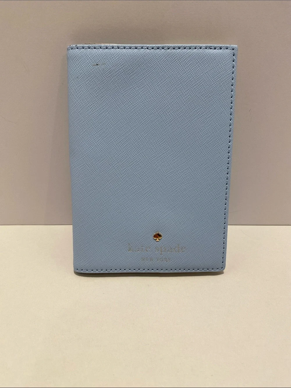 kate spade light blue passport cover. NWT. Flaw on front